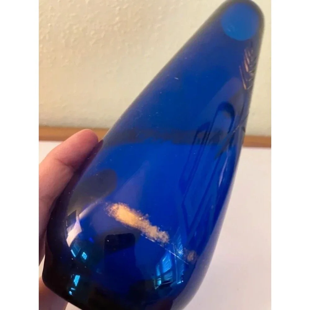 blue glass vase with etched rose